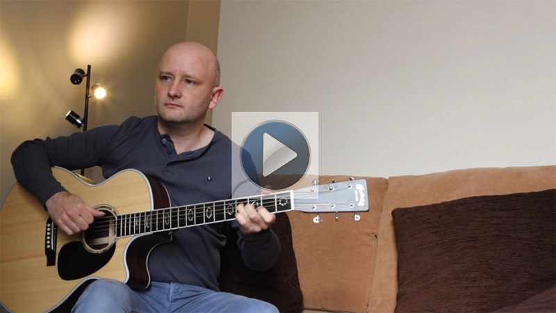 guitarist Ian Dyball playing a Martin GPC-Aura acoustic guitar